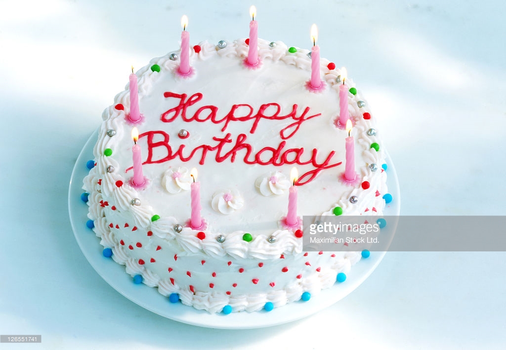 birthday-cake-with-candles-lit-picture-id126551741.jpg