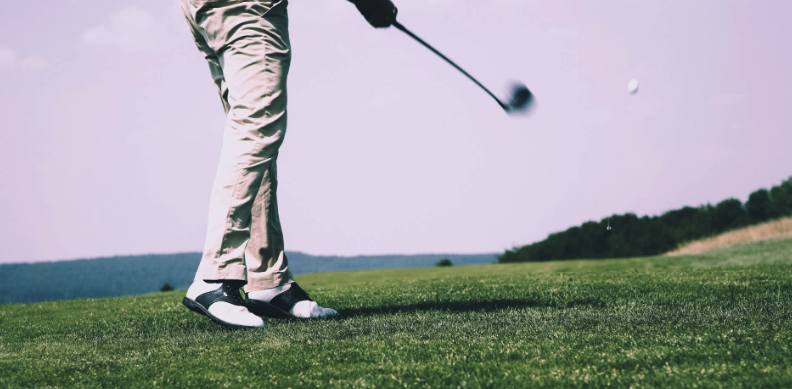 Photo of a person golfing