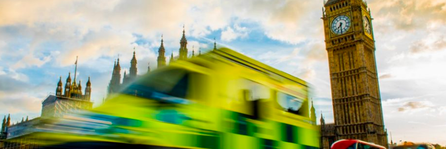Image of a fast ambulance driving in front of Big Ben
