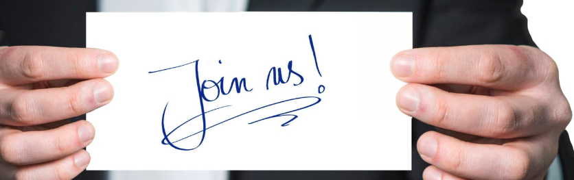 Image of a recruiter holding a "Join Us" sign